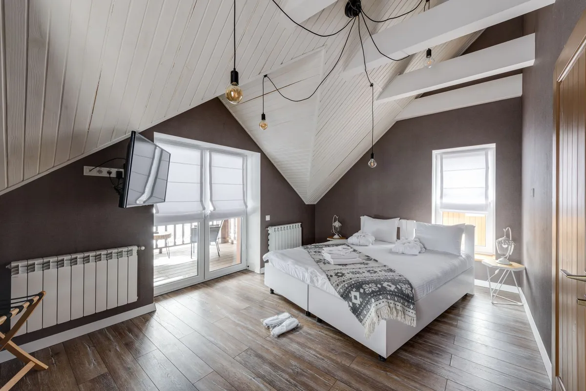 Modern Airbnb bedroom with carefully curated furniture and design aesthetic