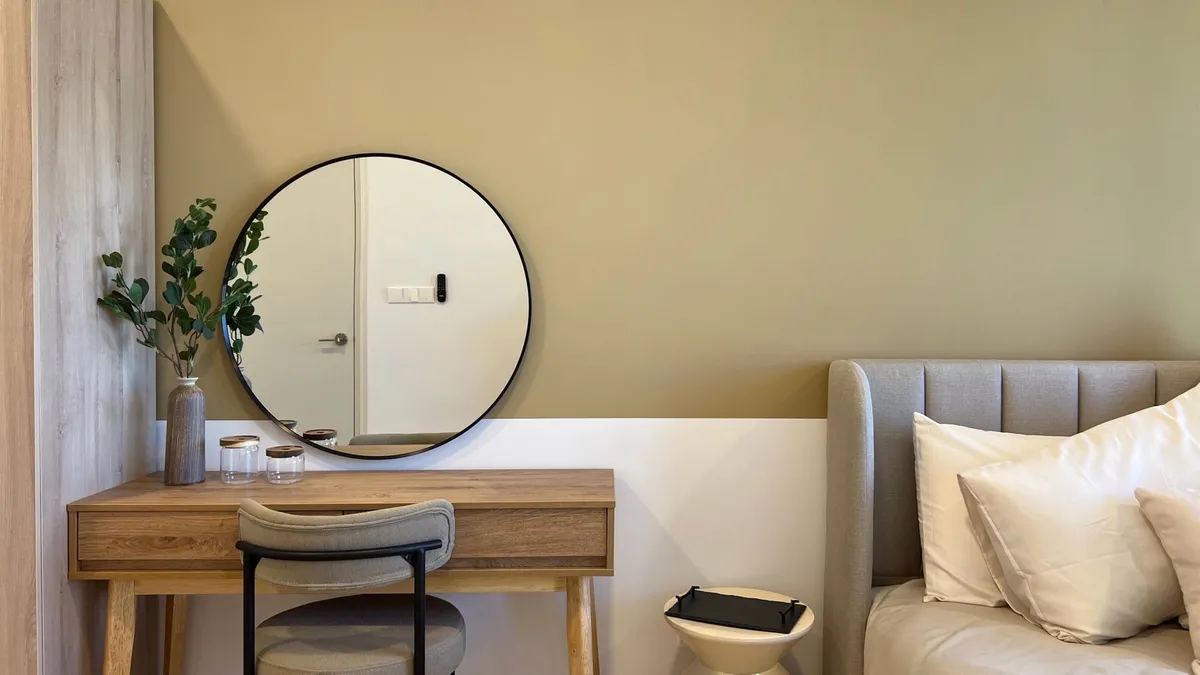 Scandinavian-style bedroom with natural wood furniture, white bedding, and minimalist nightstands