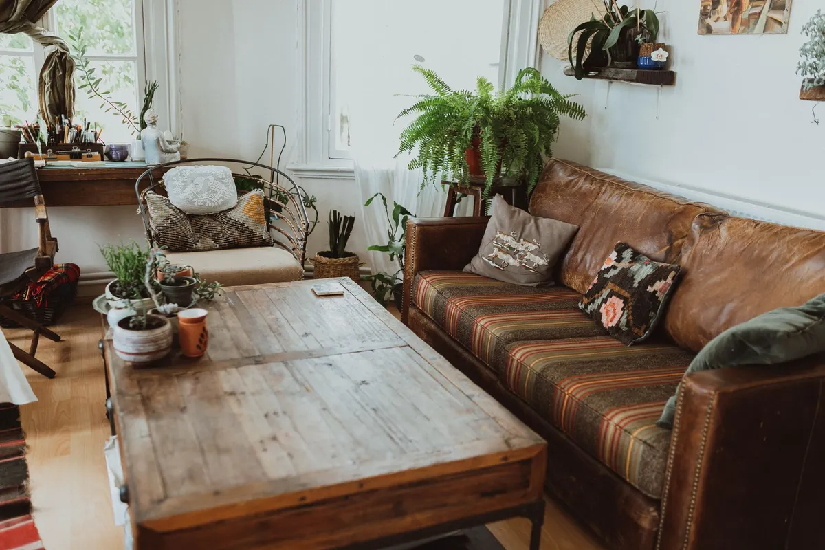 Rattan chairs and natural materials in an eclectic bohemian bedroom