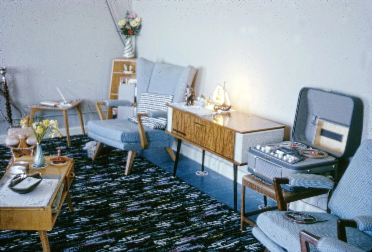 Mid-century modern living room with walnut furniture and warm tones